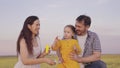 mother father little child blow bubbles picnic park. happy family life. concept children's dream. kid laughs with Royalty Free Stock Photo