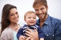 Mother, father and portrait with toddler for family, love and adoption with happiness. Man, woman and face of parents Royalty Free Stock Photo