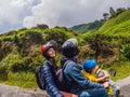 Mother, Father and son are traveling on a moped on a tea plantation in Malaysia. Traveling with children concept Royalty Free Stock Photo