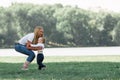 Mother, father and their little son are playing with the ball on the lawn. Royalty Free Stock Photo