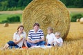 Mother, father and two little sons having picnic Royalty Free Stock Photo
