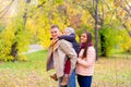 Mother and Father With Young Son On his back Autumn Park Royalty Free Stock Photo