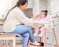 Mother, feed and child food in chair for baby development, nutrition meal or dinner snack. Kid, woman and eating Royalty Free Stock Photo