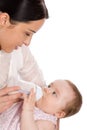 Mother feeding baby daughter Royalty Free Stock Photo