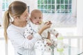 Mother feeding baby food Royalty Free Stock Photo