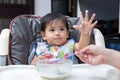 Mother feeding baby food to her child Royalty Free Stock Photo