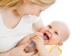 Mother feeding her adorable baby boy from bottle