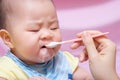 Mother feeding her asian thai baby girl Royalty Free Stock Photo