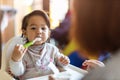 Mother feeding her baby Royalty Free Stock Photo