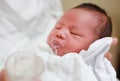 Mother feeding milk infant baby by glass cup Royalty Free Stock Photo