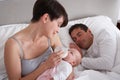 Mother Feeding Newborn Baby In Bed At Home Royalty Free Stock Photo