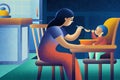 Mother feeding young child at kitchen table in vibrant evening scene Royalty Free Stock Photo