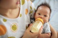 mother feeds breastmik by bottle Royalty Free Stock Photo
