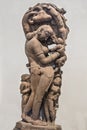 Mother fondling child - Archaeological statue made from sandstone. Royalty Free Stock Photo