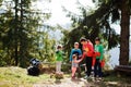 Mother with four kids resting in mountains. Family travel and hiking with childrens Royalty Free Stock Photo