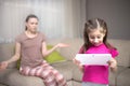 Mother frustrating that her daughter playing video games. Royalty Free Stock Photo