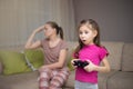 Mother frustrating that her doughter playing video games.