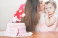 Mother with funny baby celebrating first birthday. Cake. Royalty Free Stock Photo