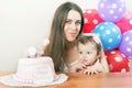 Mother with funny baby celebrating first birthday. Cake. Royalty Free Stock Photo