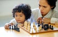 Mother, girl and chess play fun for learning growth, development challenge or bonding time. Child, woman or board game