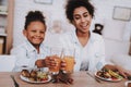 Mother and Girl Drinking Juice. Happy Time Family. Royalty Free Stock Photo