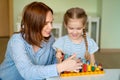 Mother with girl learning to add and subtract