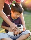 Mother give little terrier kid to son