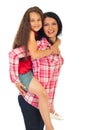 Mother gives piggy back ride to her daughter Royalty Free Stock Photo