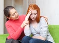 Mother gives solace to crying daughter Royalty Free Stock Photo