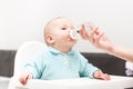 Mother Giving Baby To Drink Water From Bottle Royalty Free Stock Photo