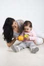 Mother giving fruits to her little baby Royalty Free Stock Photo
