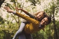 Mother giving her daughter piggyback ride. Royalty Free Stock Photo