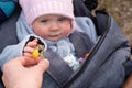 Mother giving a yellow flower to her child. Royalty Free Stock Photo