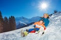 Mother go downhill together with little boy siting in the sledge Royalty Free Stock Photo