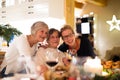 Mother, grandmother and daughter celebrating Christmas.