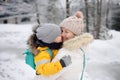 Mother or grandmother with her little son or grandson embrace in winter day Royalty Free Stock Photo