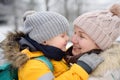 Mother or grandmother with her little son or grandson embrace in winter day Royalty Free Stock Photo