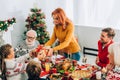 Mother greeting daughter with present, standing