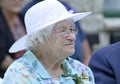 Mother of Groom looks on wedding of son with soft tenderness