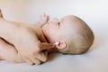 Mother hand cleaning baby ear on towel Royalty Free Stock Photo