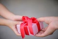 Mother hand giving a gift box to her child. Holidays, present, Royalty Free Stock Photo