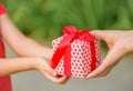 Mother hand giving a gift box to her child. Holidays, present, Royalty Free Stock Photo