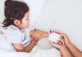 Mother hand holding sick daughter hand who have IV solution Royalty Free Stock Photo