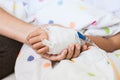 Mother hand holding sick daughter hand who have IV solution Royalty Free Stock Photo