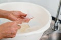 mother hand washing the baby nipple of milk bottle Royalty Free Stock Photo