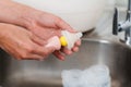 mother hand washing the baby nipple of milk bottle Royalty Free Stock Photo