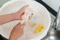 mother hand washing baby plastic milk bottle Royalty Free Stock Photo