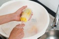 mother hand washing baby plastic milk bottle Royalty Free Stock Photo