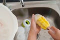 mother hand washing baby plastic milk bottle Royalty Free Stock Photo