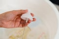 mother hand washing the baby nipple of milk bottle Royalty Free Stock Photo